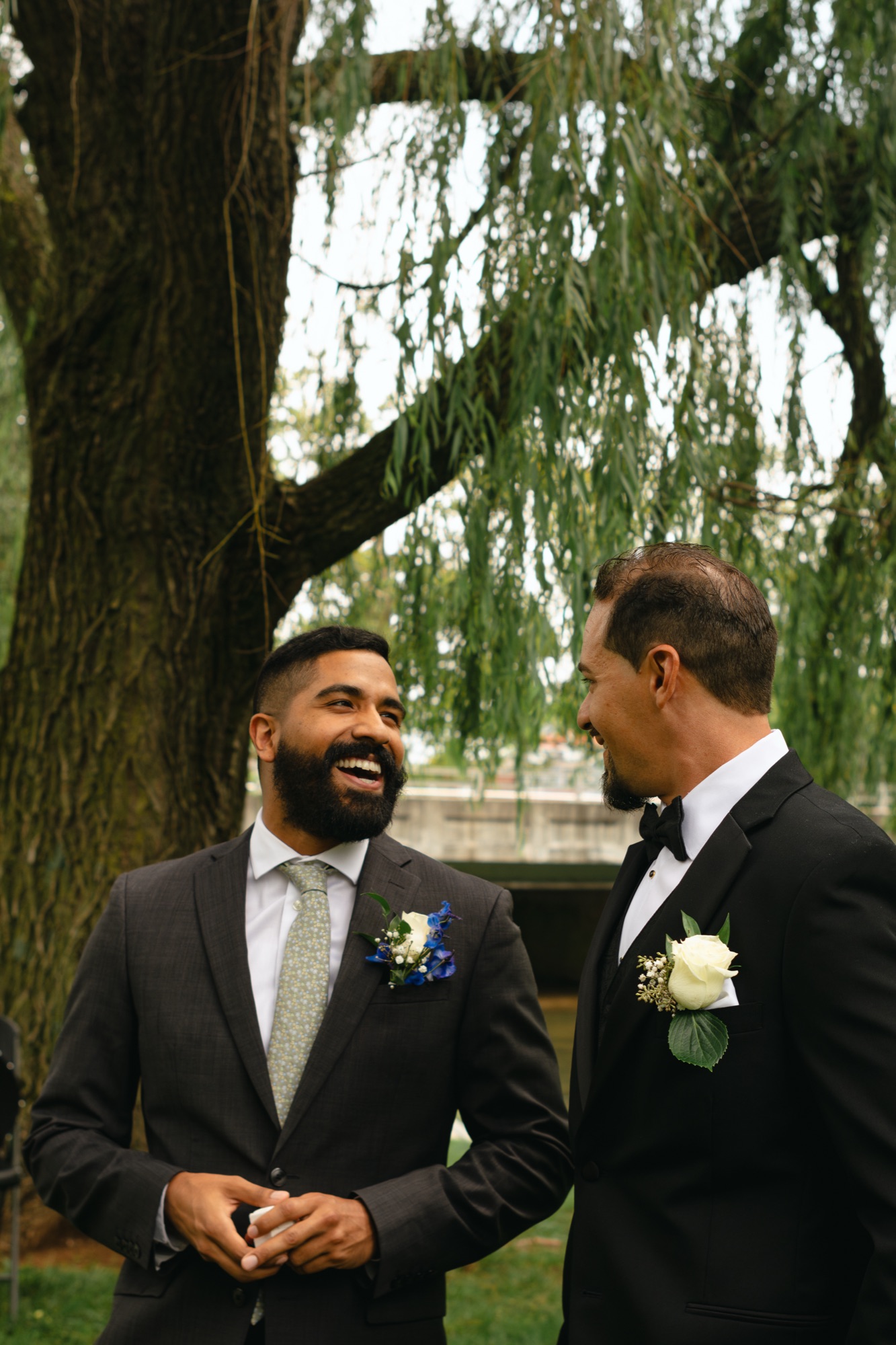 Groom laughing with a groomsman