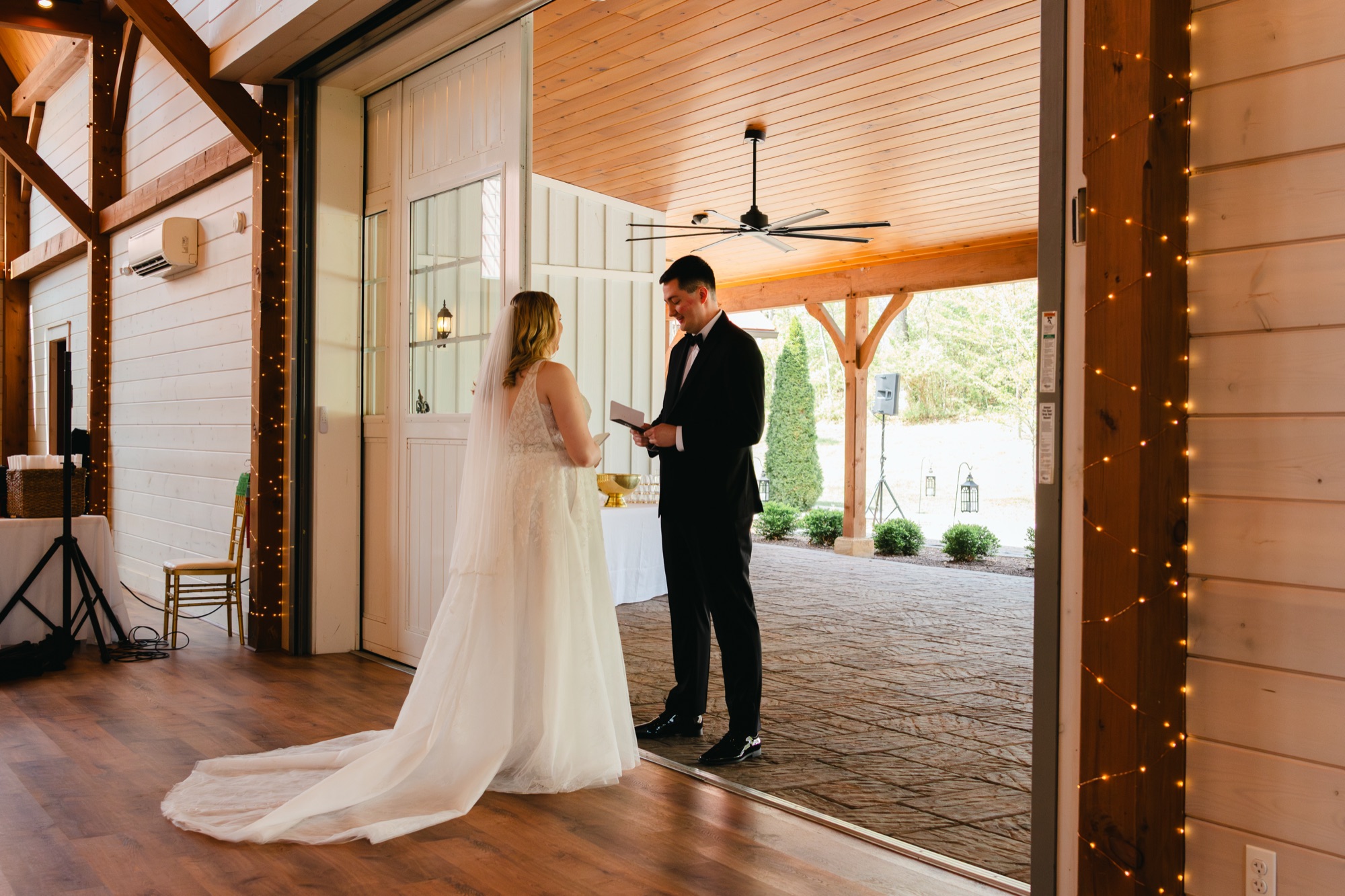 Bride and groom first look under string lights