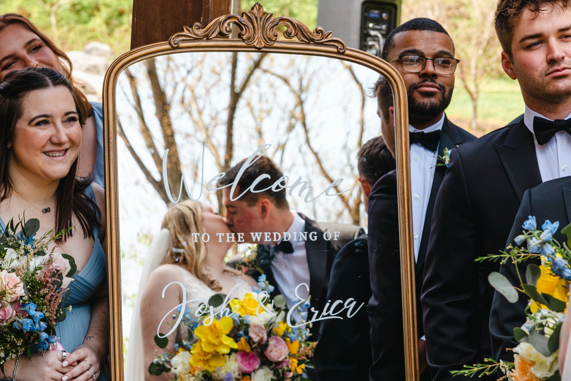 Welcome mirror reflecting the couple's kiss
