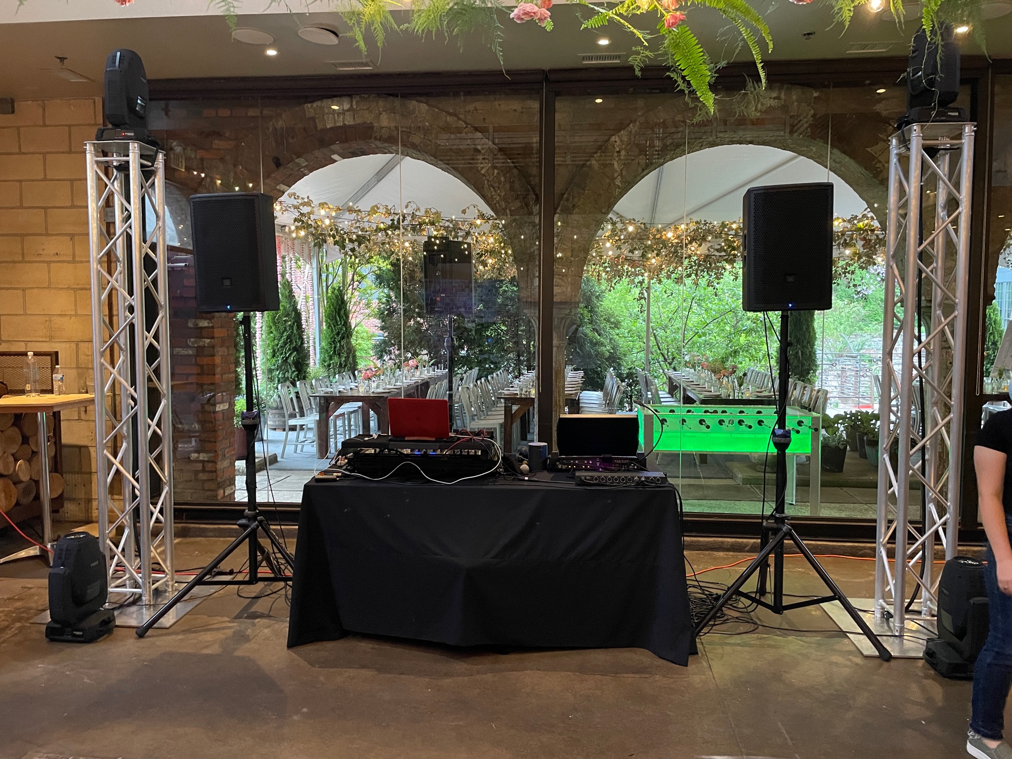 DJ booth, speakers and lighting truss at a wedding venue